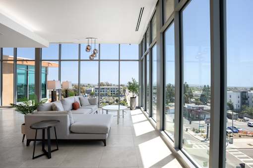 A modern living room with a view of the city.