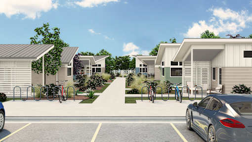a row of houses with cars parked in a parking lot