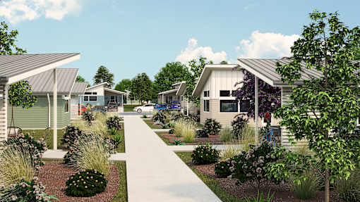 a neighborhood of manufactured homes with a sidewalk and landscaping