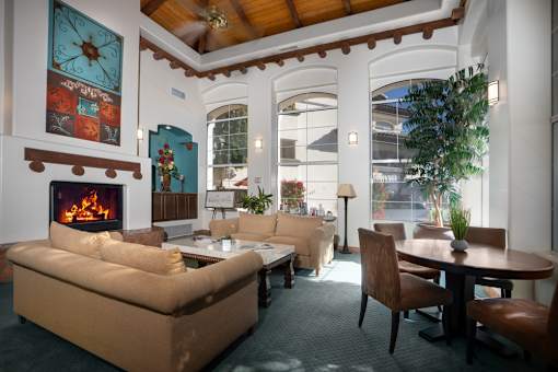 A living room with a fireplace and a couch.