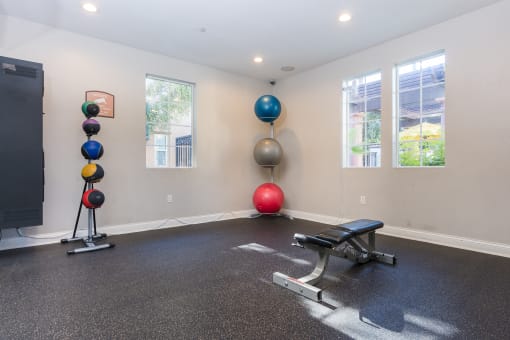 a workout room at the enclave at woodbridge apartments in sugar land, tx