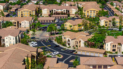 A residential area with houses and a road.