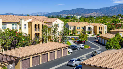 A residential area with houses and cars.