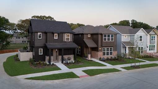 A house with a grey roof and a white garage door.