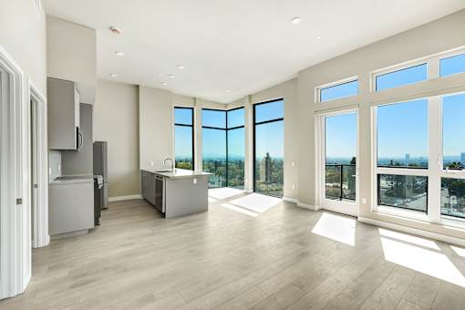 A spacious kitchen with a view of the city at Skyview Sunset Apartments, Los Angeles