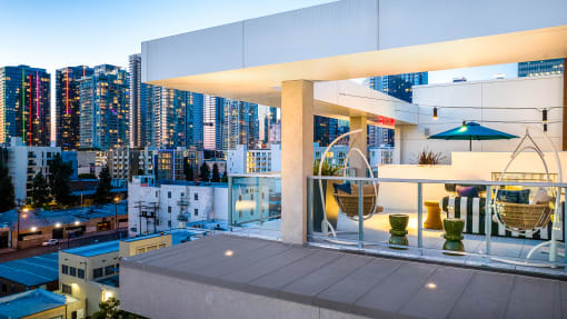 a view of the city from an apartment balcony