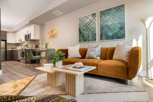 Apartments for Rent in Downtown Los Angeles, CA - The Emerald - Living Room with Floor-to-Ceiling Window, Abstract Coffee Table, and Luxury Plank Flooring