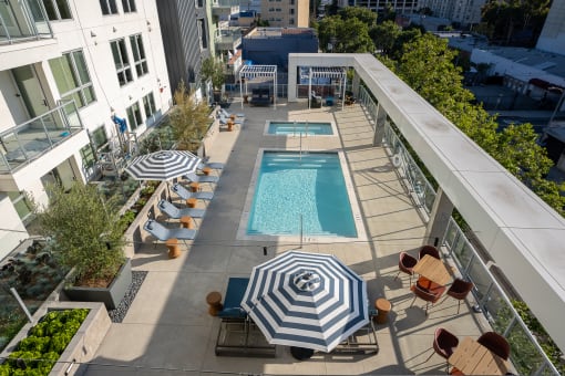 an aerial view of the outdoor pool and lounge area at the ace hotel los angeles