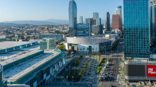 an aerial view of the los angeles convention and exhibition center with the city in the background