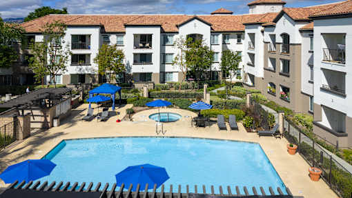 Aerial view of apartment and pool at 55+ FountainGlen Grand Isle, California