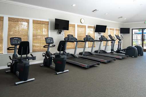 Fitness center with cardio equiipment at 55+ FountainGlen Grand Isle, California
