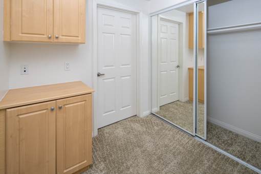 Hallway Closet and Storage Cabinets at 55+ FountainGlen Grand Isle, Murrieta California
