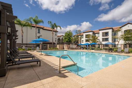 Pool with launches at 55+ FountainGlen Grand Isle, Murrieta, CA