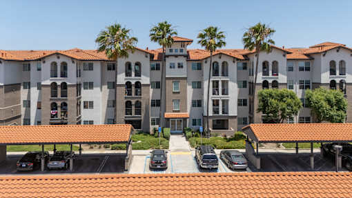 A building with a parking lot in front of it. at 55+ FountainGlen Terra Vista, Rancho Cucamonga, 91730