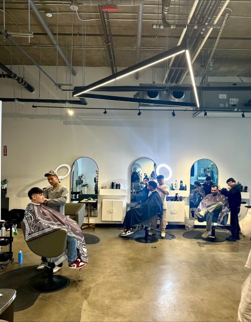 Salon giving haircuts to customers at Imperial Hardware Lofts, Riverside, CA, 92501