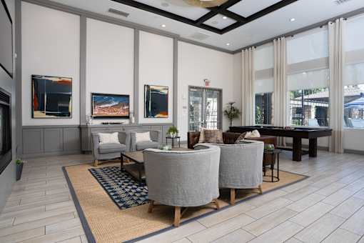 Living room with grey sofa at The Grove Apartments, California, 91761