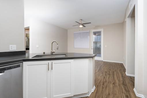 Kitchen with sink at The Grove Apartments, Ontario, CA
