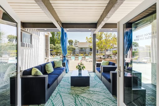 patio with couches and coffee table at Harbor Pointe, California