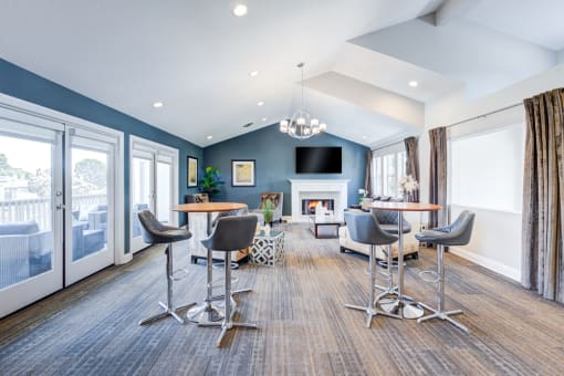 a living room with tables and chairs and a fireplace at Harbor Pointe, Dana Point, CA, 92629