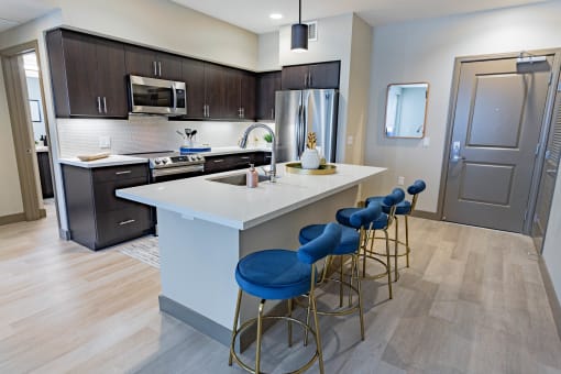 furnished kitchen with stool seating