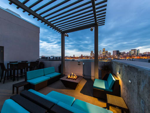 Rooftop Deck With Fire Pit, Plush Seating, Tables, Chairs, And Amazing Views Of The City at Waterford RiNo, Denver, CO