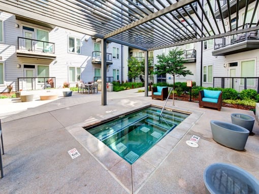 Jacuzzi Area with Seating Area Under Wooden Canopy at Waterford RiNo, Denver, Colorado