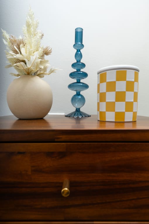 a table with a vase and a cup on it at Imperial Hardware Lofts, Riverside, CA, 92501