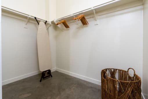 a room with a surfboard and a basket on the floor at Imperial Hardware Lofts, California, 92501