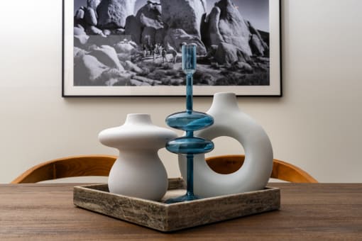 a table with two vases and a toothbrush on it at Imperial Hardware Lofts, Riverside, CA