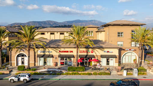 A building with a spa and restaurant on the ground floor and a hotel on the upper floor.