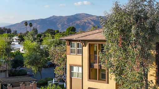 A building with a mountain in the background.