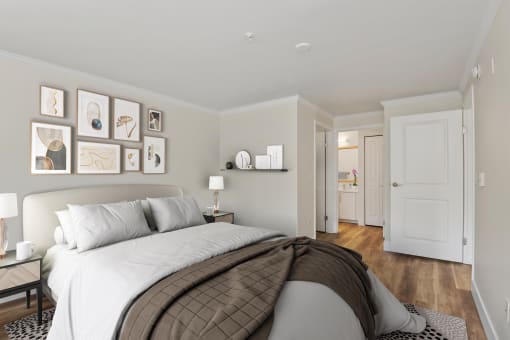 a bedroom with a bed and a door to a bathroom at Lakemont Orchard, Issaquah, WA 98027  