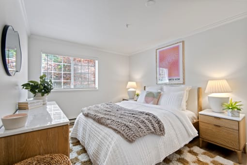 a bedroom with a bed and a dresser and a window at Lakemont Orchard, Issaquah Washington  