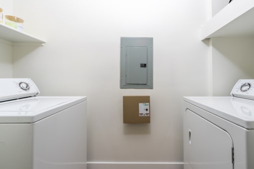 Washer and dryer in a laundry room at Level at Sixteenth, Phoenix, AZ