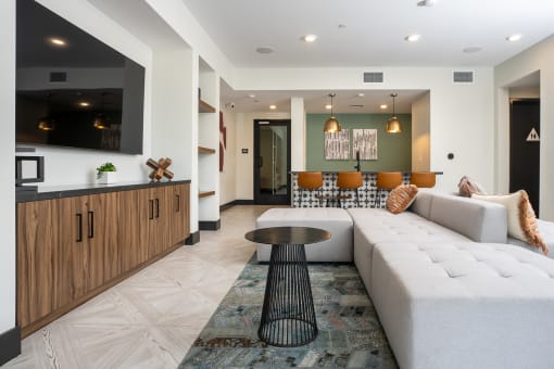 a living room filled with furniture and a large window