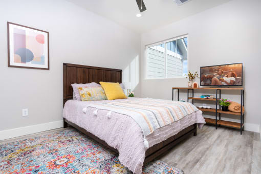 mihir taylor model bedroom with a bed and a window