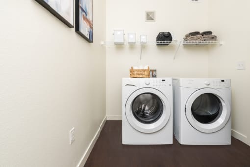 a washer and dryer in a laundry room at Miro at the Parc, Henderson, Nevada