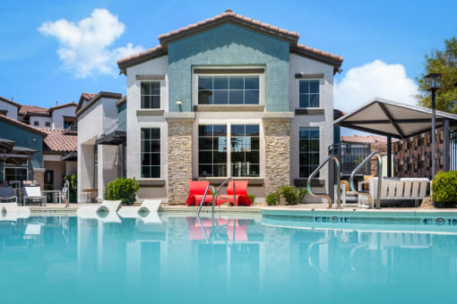 a large swimming pool in front of a house at Miro at the Parc, Nevada 89074