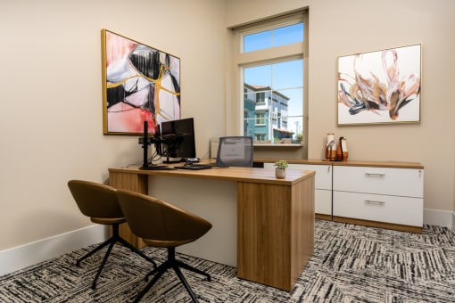 an office with a desk with a computer and a window at Miro at the Parc, Henderson, NV