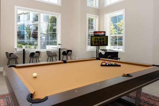 a pool table at the district flats apartments at Miro at the Parc, Henderson, Nevada