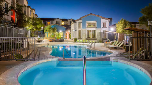 a swimming pool at night at Miro at the Parc, Henderson, 89074