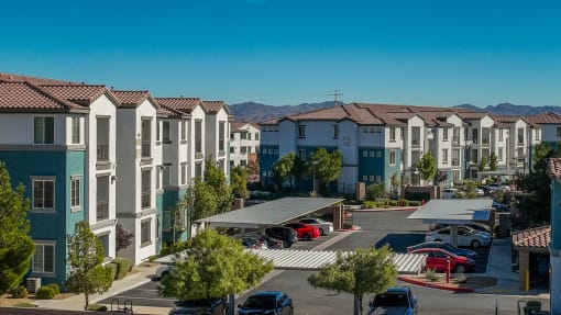 an aerial view of a parking lot with the building exterior at Miro at the Parc, Nevada 89074