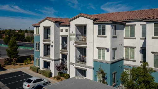 an aerial view of an apartment building with a parking lot at Miro at the Parc, Henderson, NV