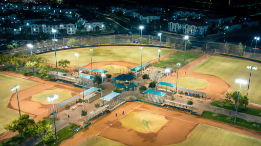 an aerial view of a baseball field at night at Miro at the Parc, Henderson, NV 89074