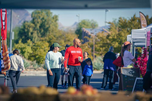 people standing around at a farmers market at Miro at the Parc, Henderson, NV