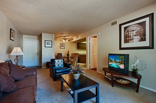 Open-Concept Living Area with Dining Room, Kitchen, and Beige Carpeting at Monaco at McCormick Ranch, Scottsdale, 85258