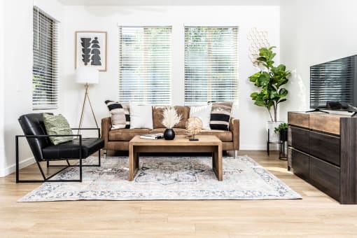 Living room with large windows at Monument, Arizona 85224