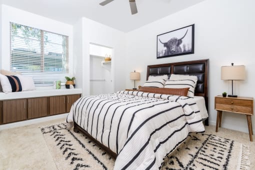 a bedroom with a bed and a window