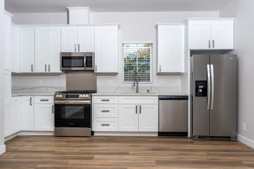 Kitchen with grey fridge and cabinet at Nola 624, West Covina, CA