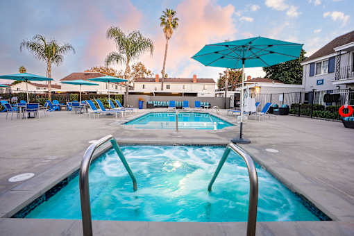 A swimming pool with a metal ladder and a metal handrail. at Nola 624, California